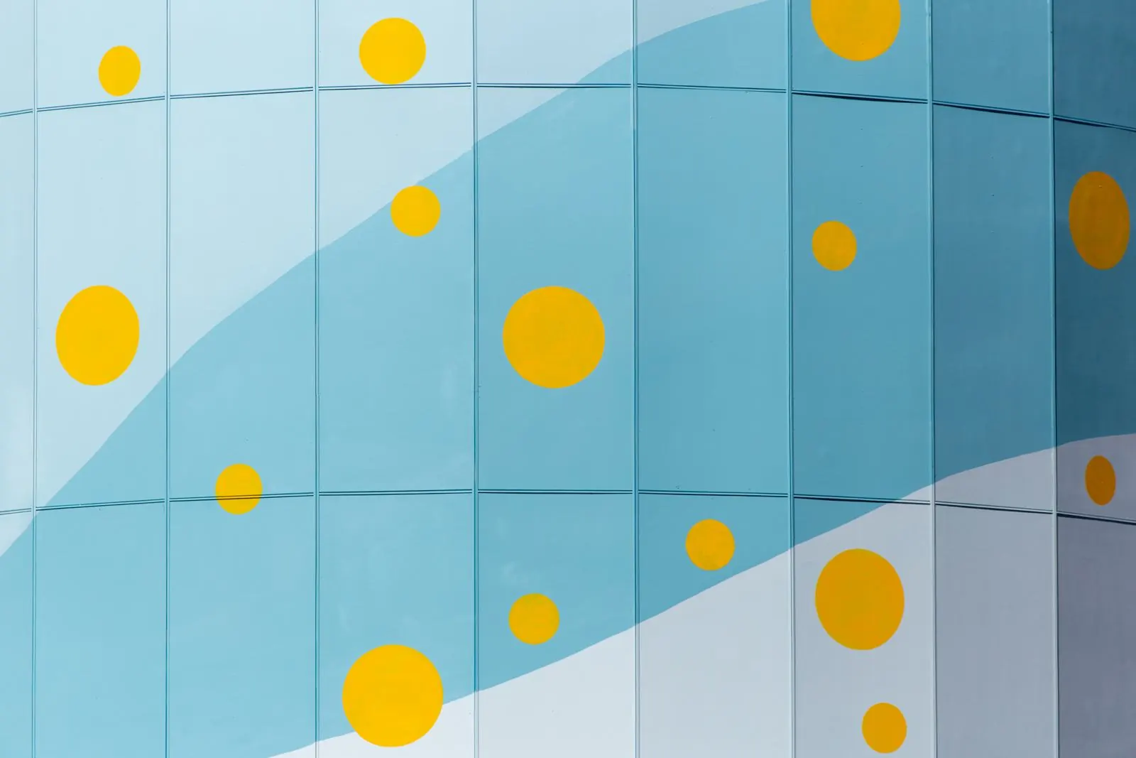 Blue wall with painted yellow dots